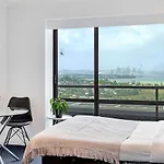 Skyline Sojourn Studio With Parking And Sea Views